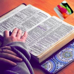 Woman reading the Bible with a highlighter, marking scripture during quiet time for spiritual growth and Bible study