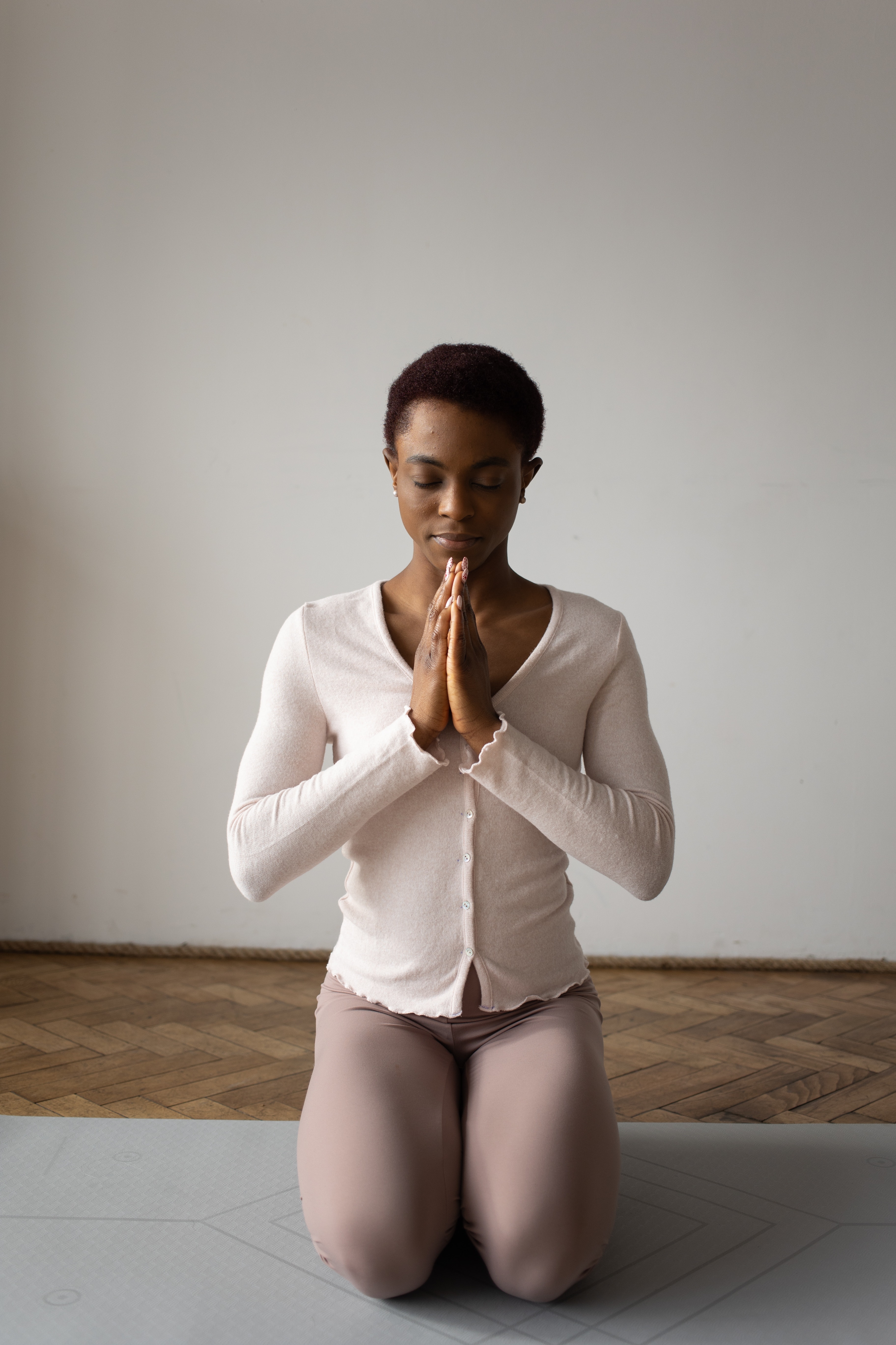 A woman on her knees praying, seeking guidance and trusting in God's plan for her life.