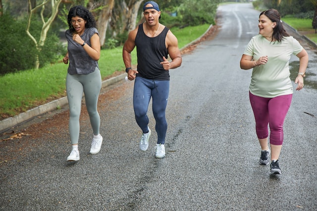 Three people joking for a healthy lifestyle