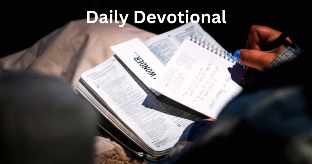 a person is sitting with an open Bible and a notepad -tip of spiritual growth