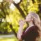 Woman in prayer outdoors, reflecting spiritual growth and journey to grow in faith.