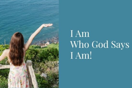 Woman lifting her hands in worship near the ocean with the text “I Am Who God Says I Am” – biblical affirmations of identity in Christ.