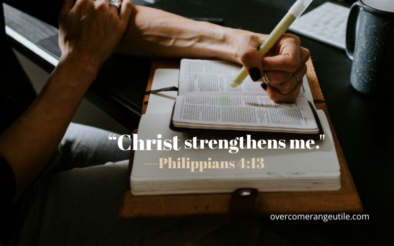 Woman studying and highlighting Scripture in the Bible with Philippians 4:13 encouragement about Christ giving strength and hope to a happier Christian.