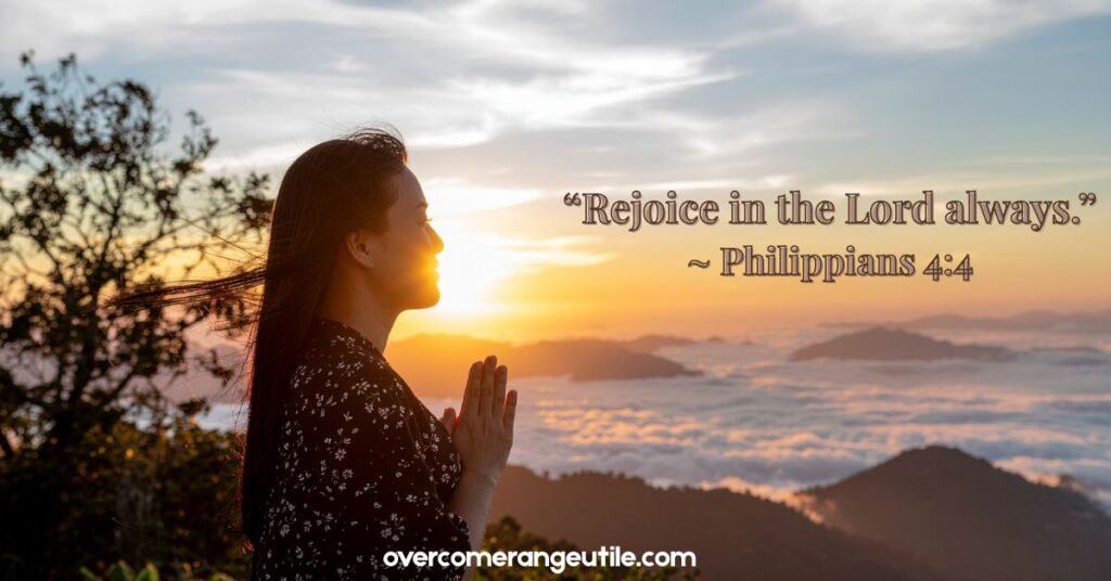 A happier Christian woman praying during sunrise on a mountain overlooking clouds, seeking peace, joy, and a closer connection with God in the morning sunlight.